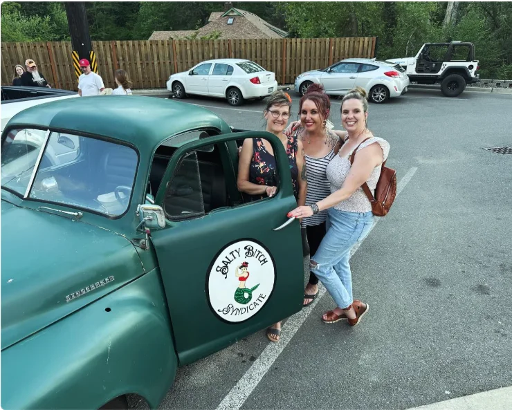 The Salty Bitch Syndicate crew with the green truck