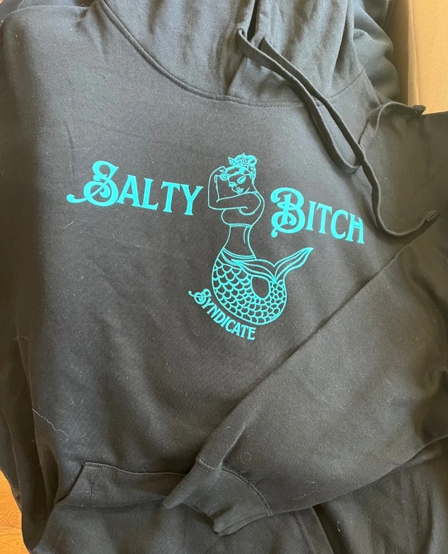Black Salty Bitch Syndicate hoodie with turquoise mermaid logo